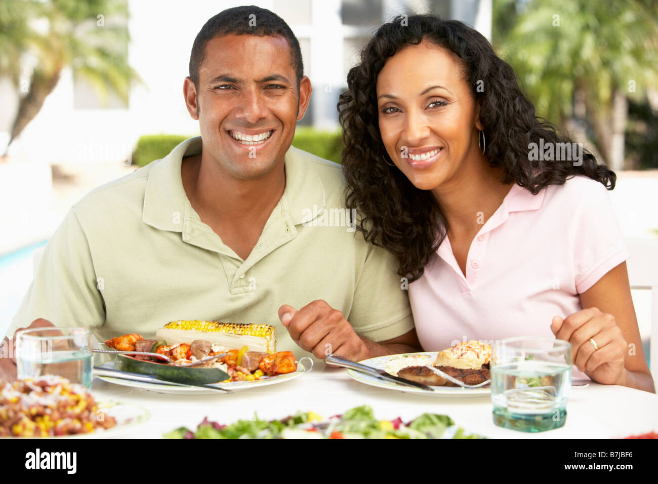 Couple Eating An Al Fresco Meal Stock Photo