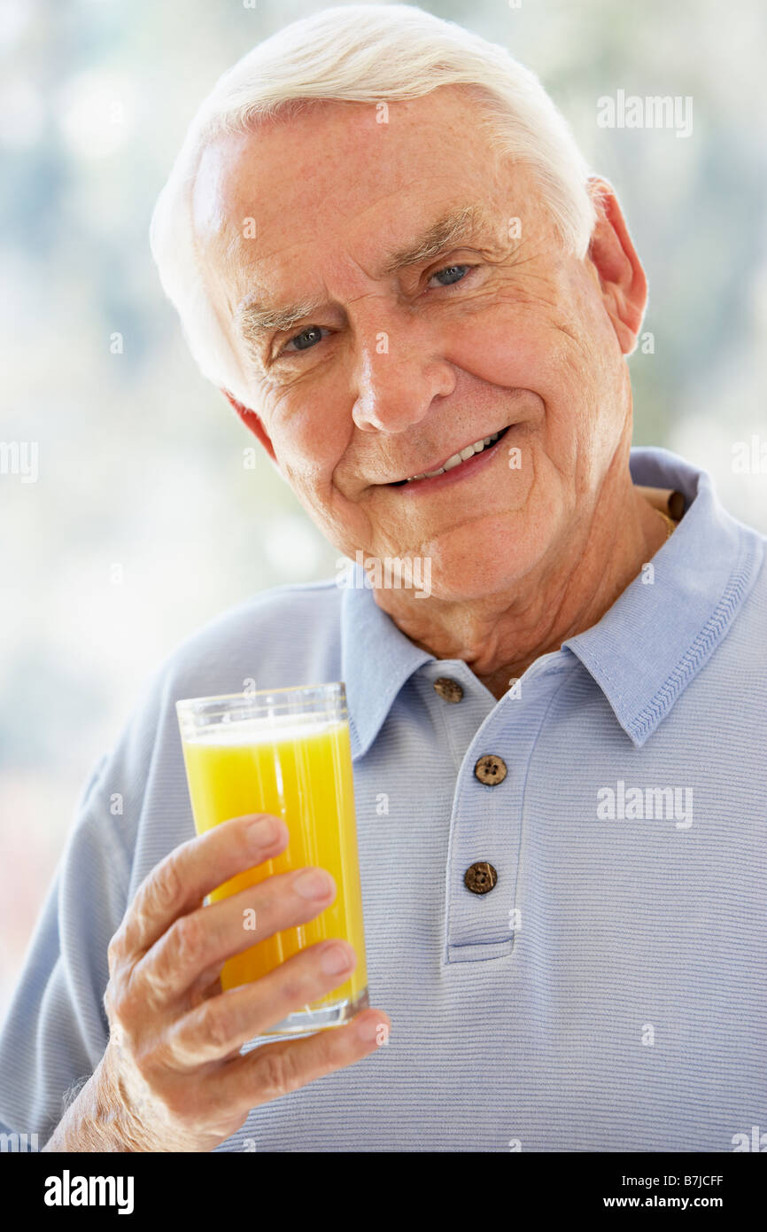 Senior Man Drinking Orange Juice High Resolution Stock Photography And Images Alamy