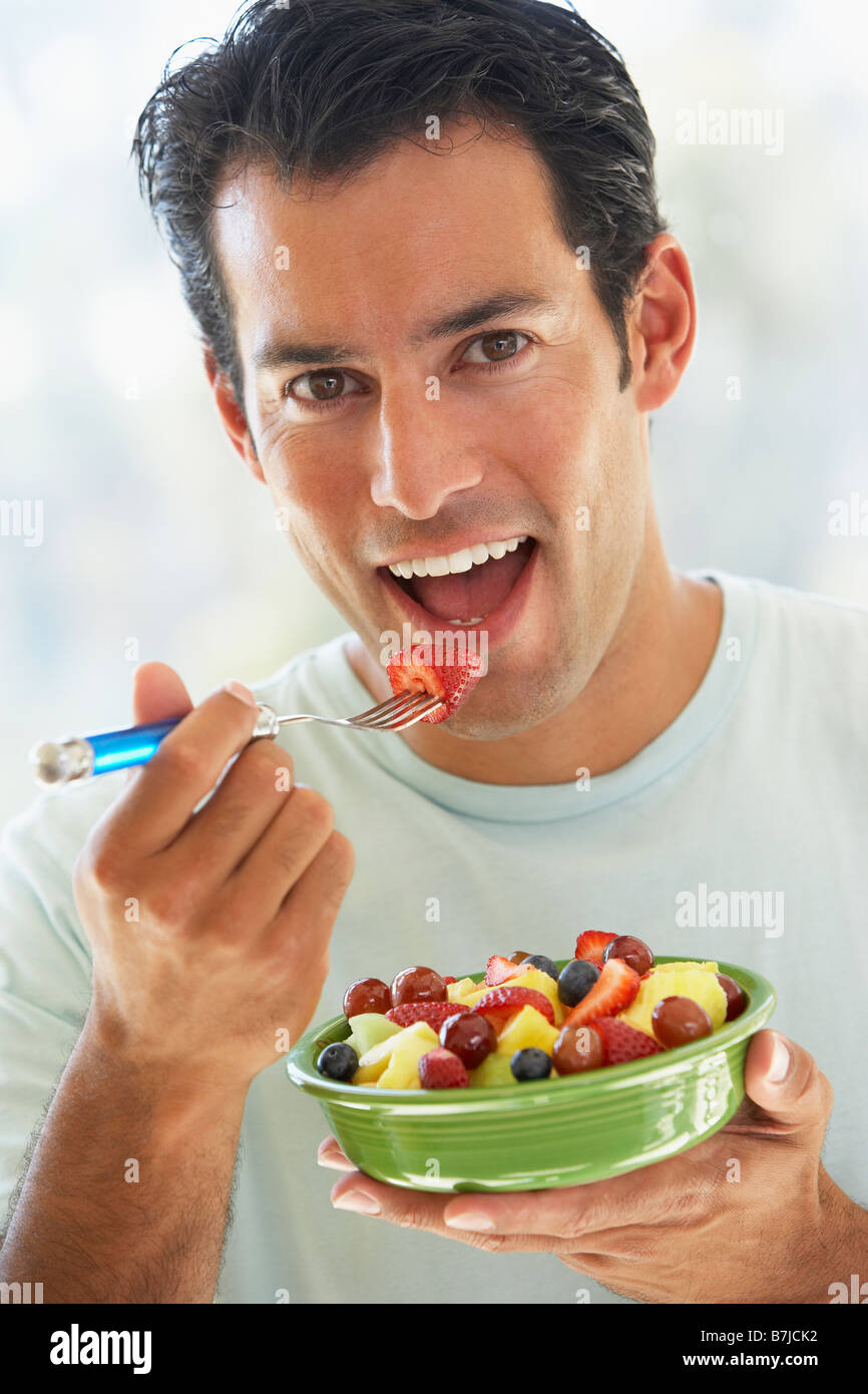 Mid Adult Man Eating Fresh Fruit Salad Stock Photo Alamy