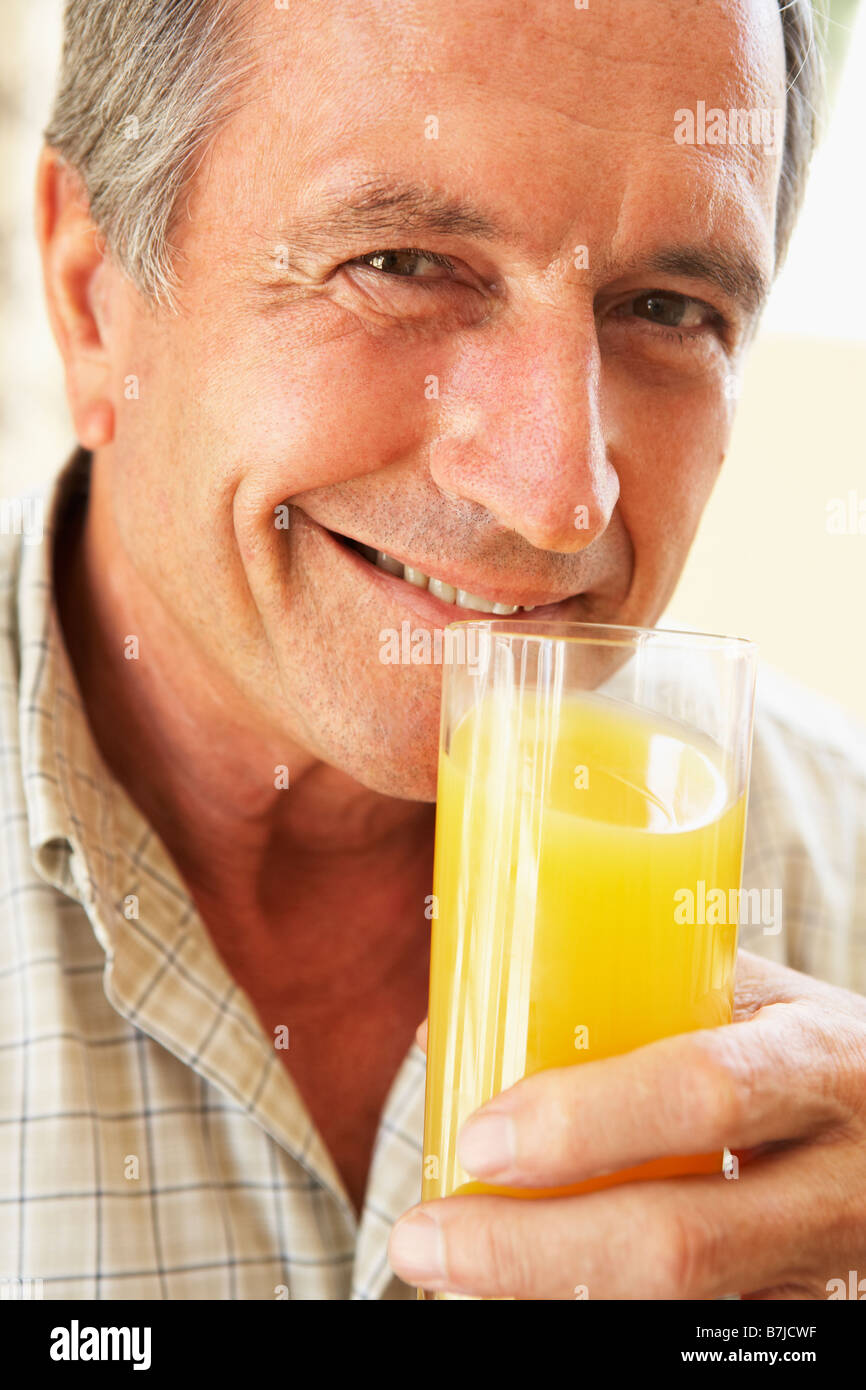 Senior Man Drinking Orange Juice High Resolution Stock Photography And Images Alamy