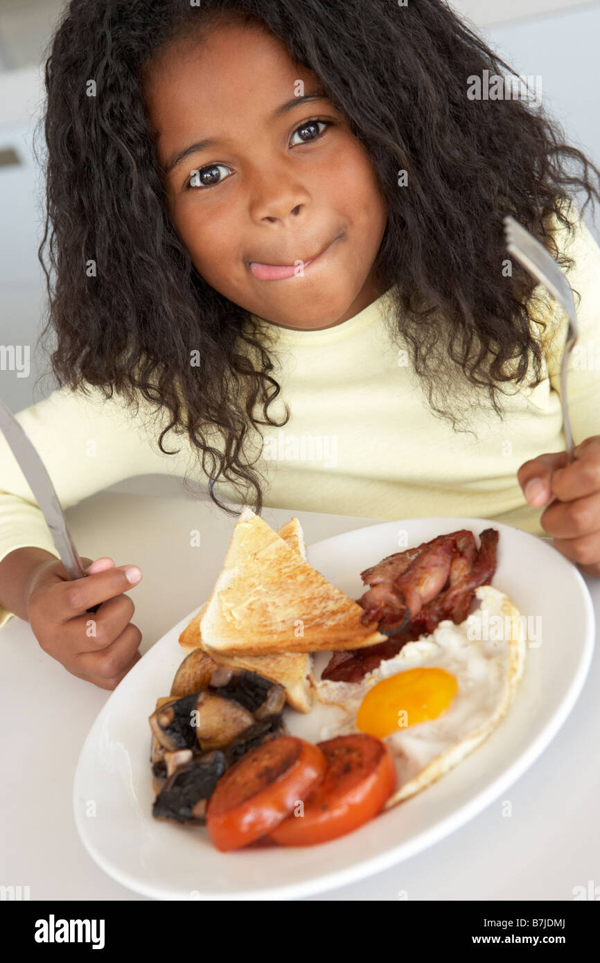 Young Girl Eating Unhealthy Breakfast Stock Photo