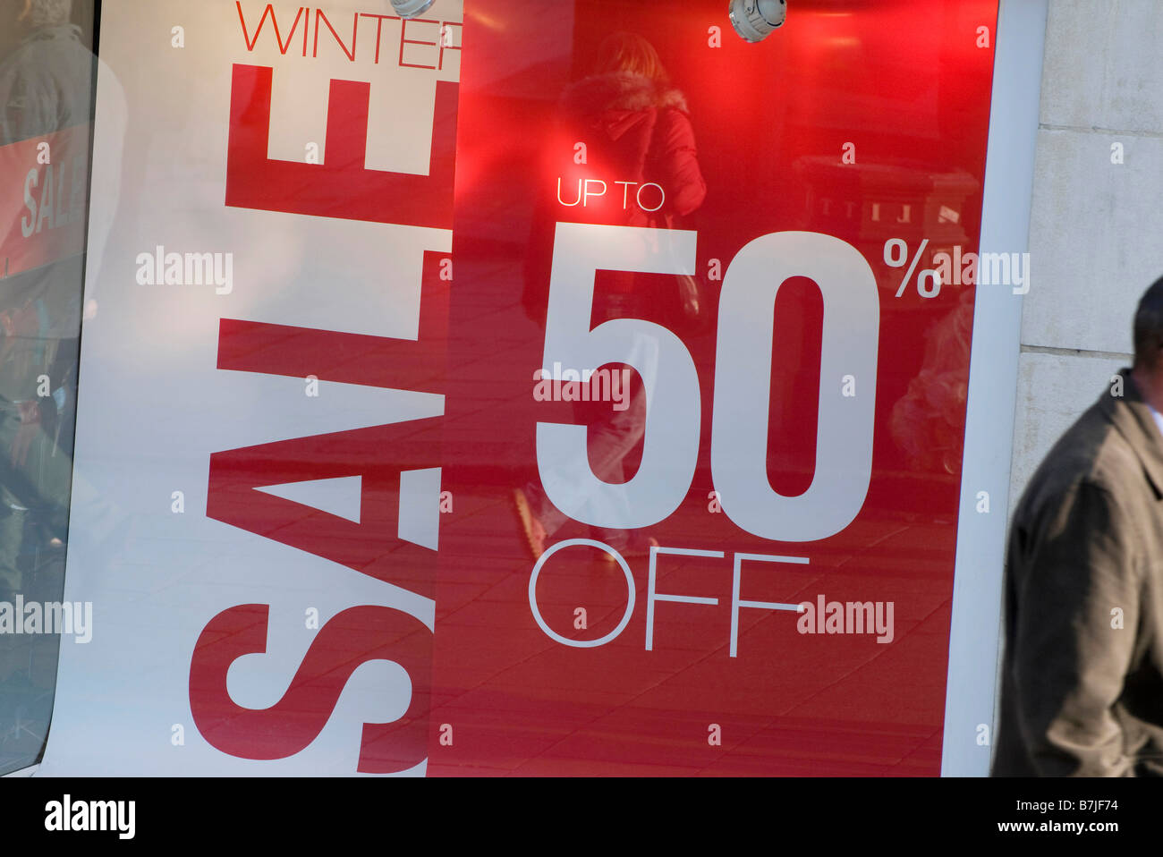 half price sale sign in shop window Stock Photo