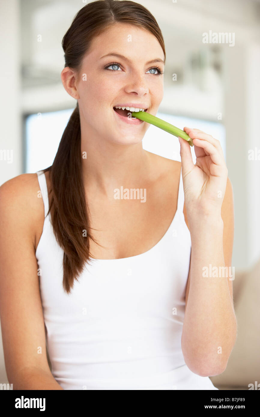 Woman eating celery sticks hires stock photography and images Alamy