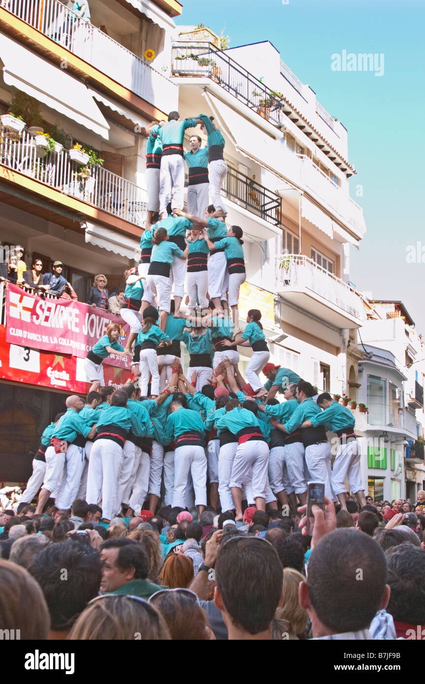 Human tower competition, castellers, Climbing up. Drawing big crowds ...