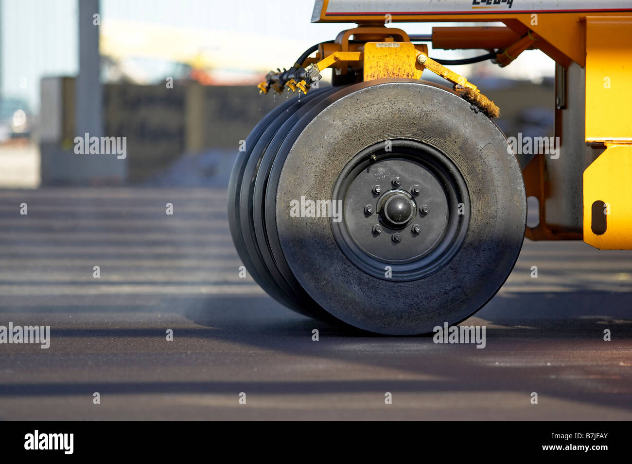 Wheels of paving roller on new asphalt; Canada, Ontario, Hamilton