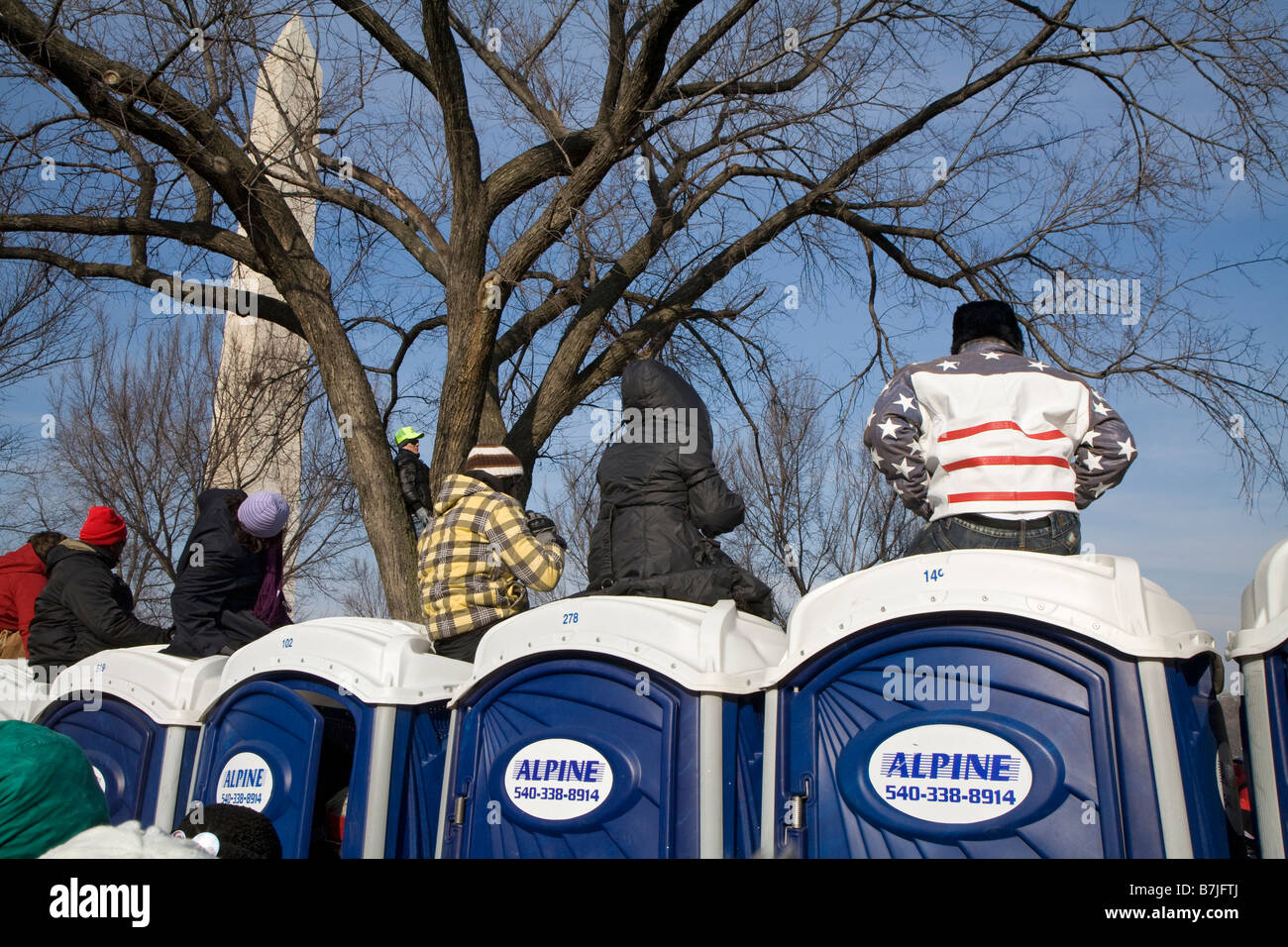 People Sit on Portable Toilets to See Obama Inauguration Stock Photo