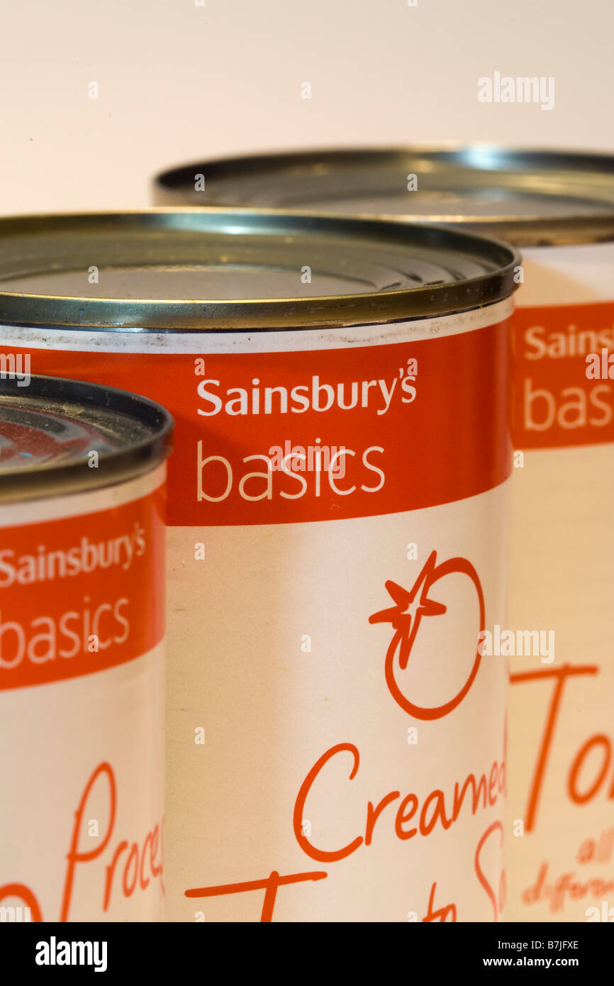 Close up of three tins of Sainsburys Basics economy range tinned food Stock Photo