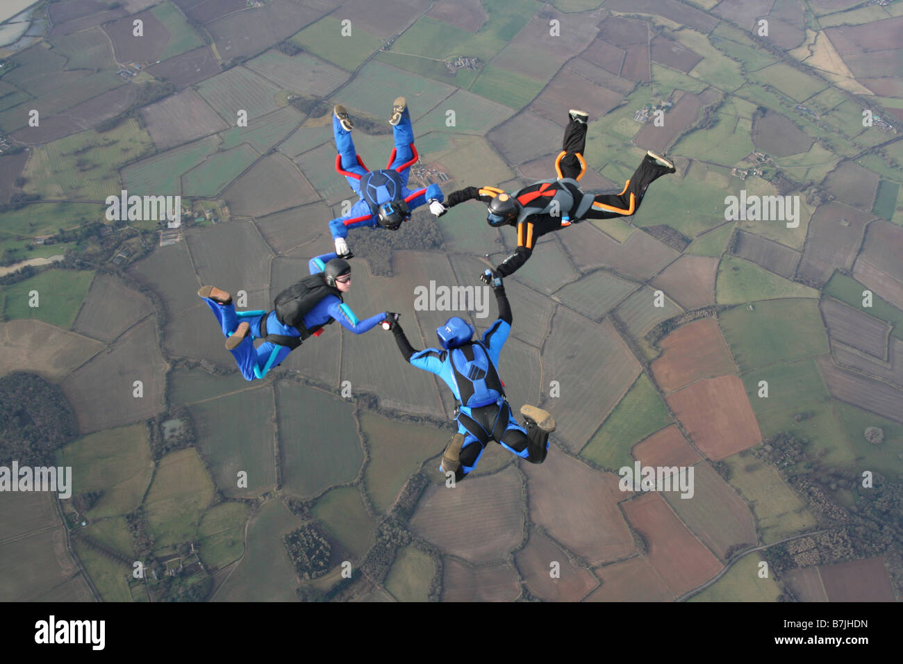 Four skydivers in a star formation Stock Photo