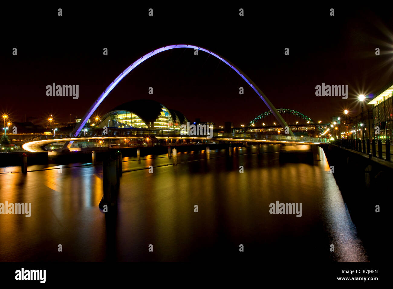Night time view of the Sage Gateshead also the  Millennium, Tyne and High level bridges joining Newcastle to Gateshead Stock Photo