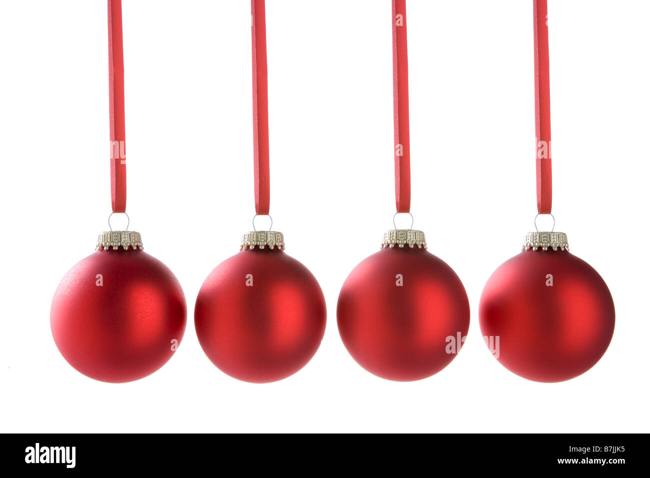 Four Red Christmas Baubles Stock Photo