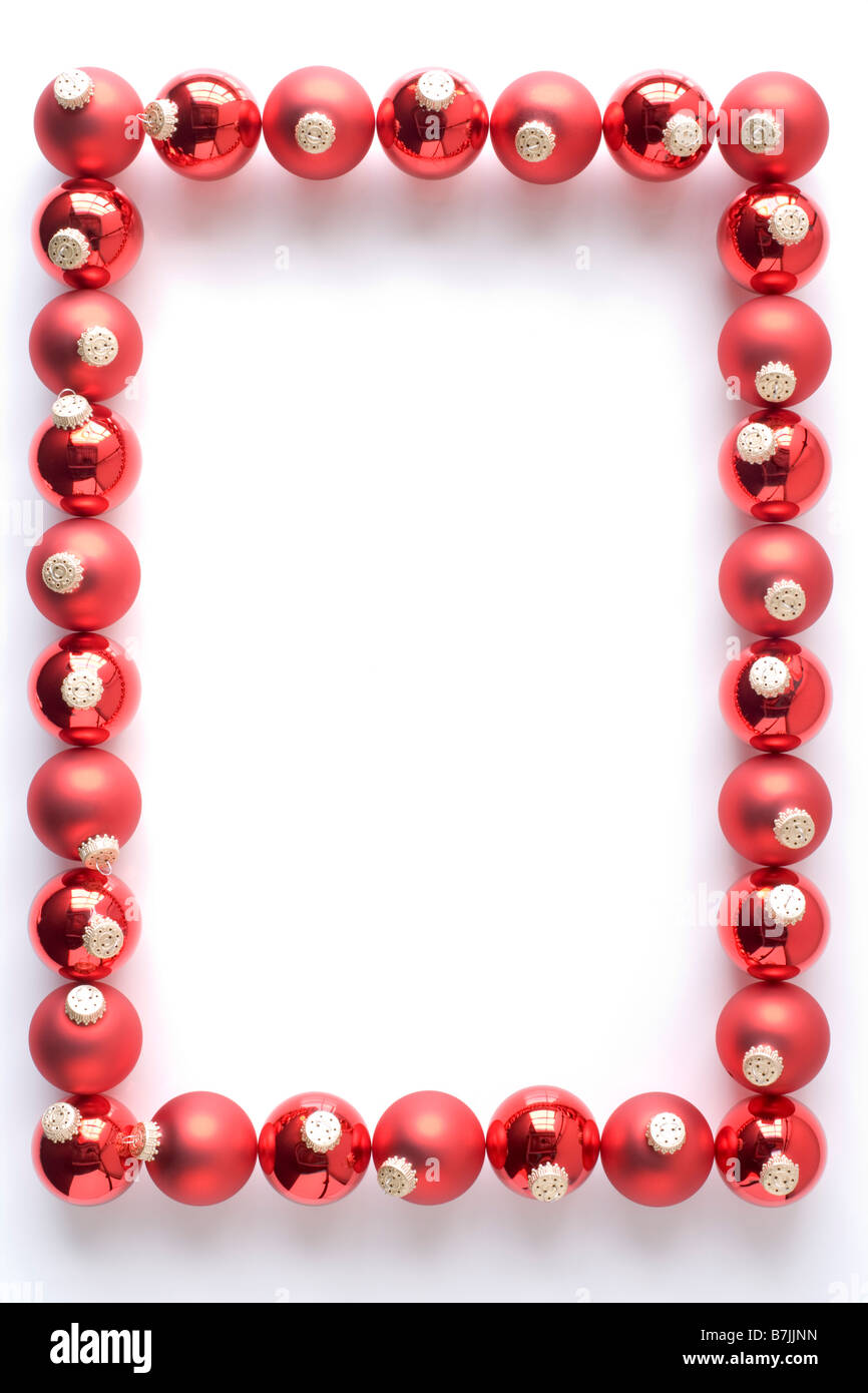Border Made From Red Baubles Against White Background Stock Photo