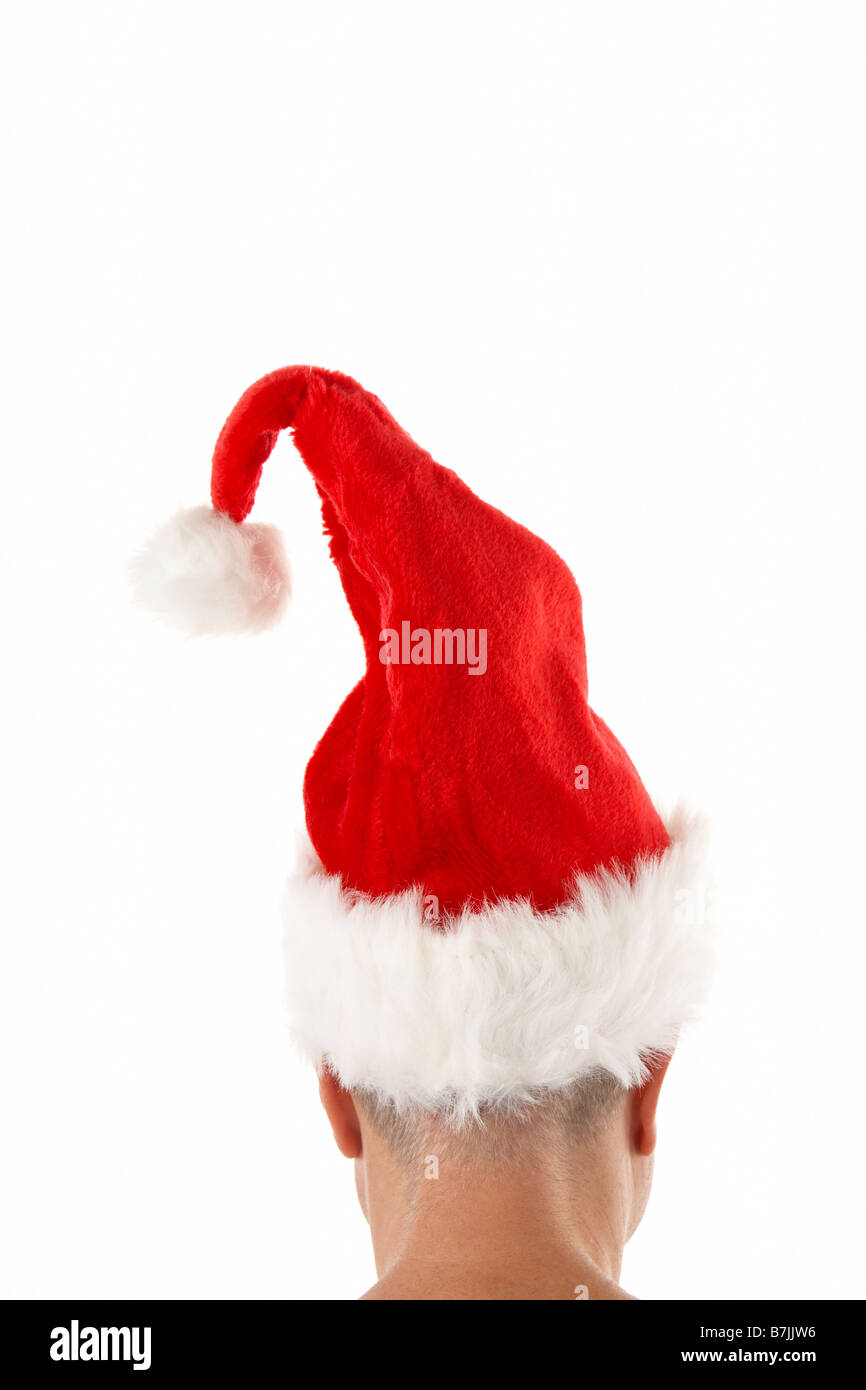 Man Wearing Santa Hat Against White Background Stock Photo