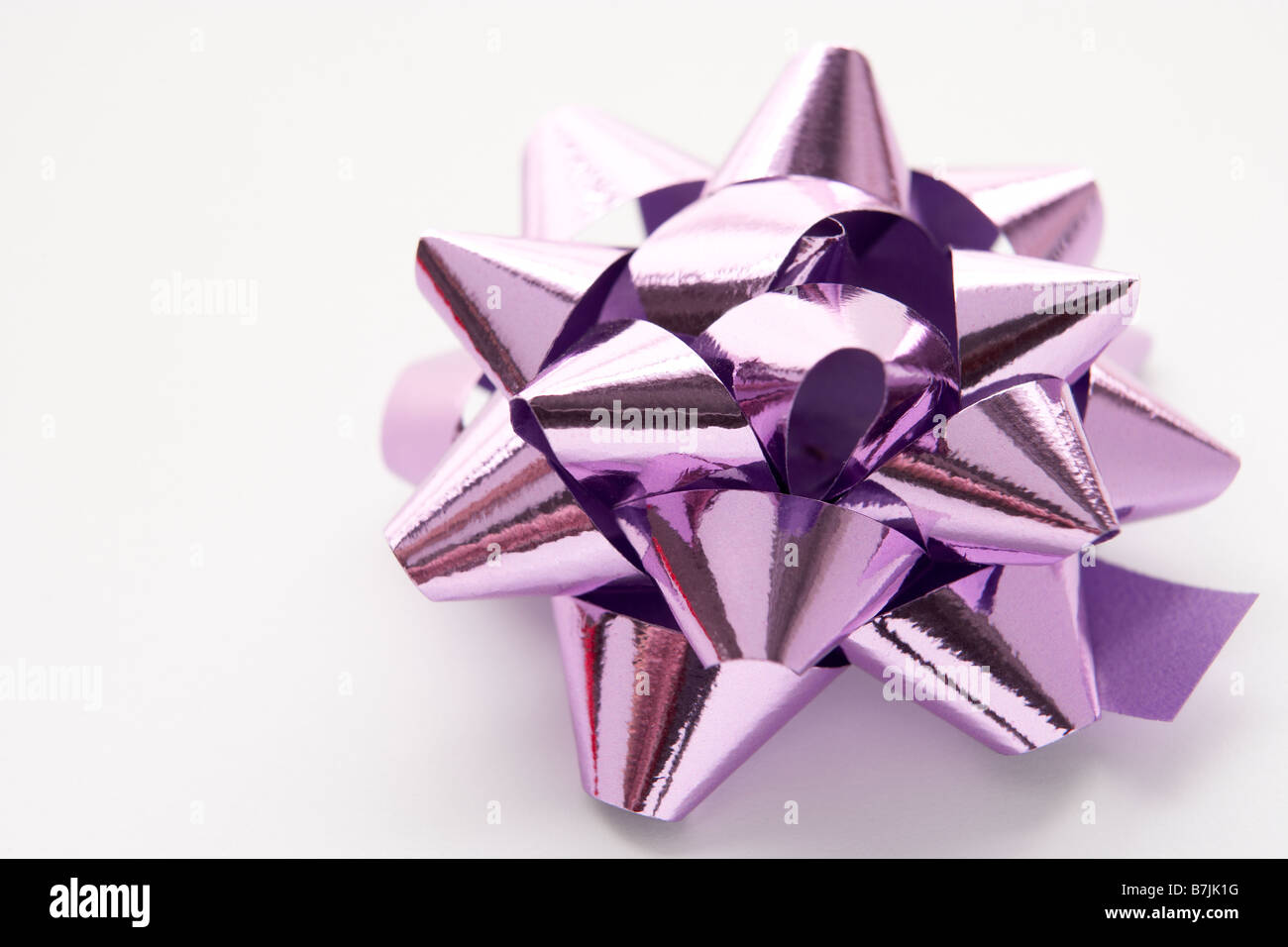 Purple Gift Wrap Bow Against White Background Stock Photo Alamy
