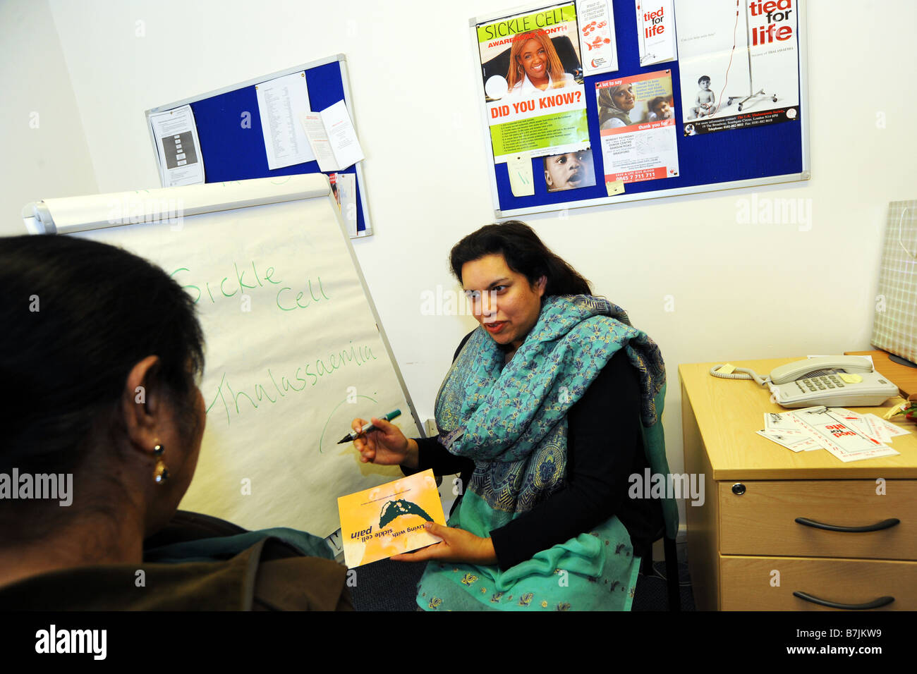 An NHS Counsellor advises a patient about congenital diseases Bradford West Yorkshire Stock Photo
