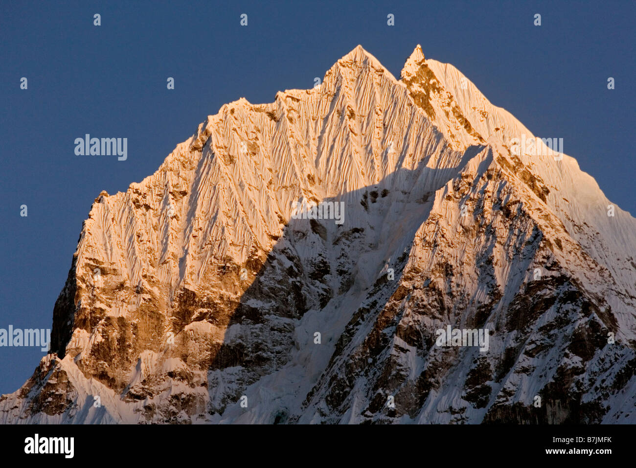 Thamserku is a mountain in the Himalaya of eastern Nepal Stock Photo