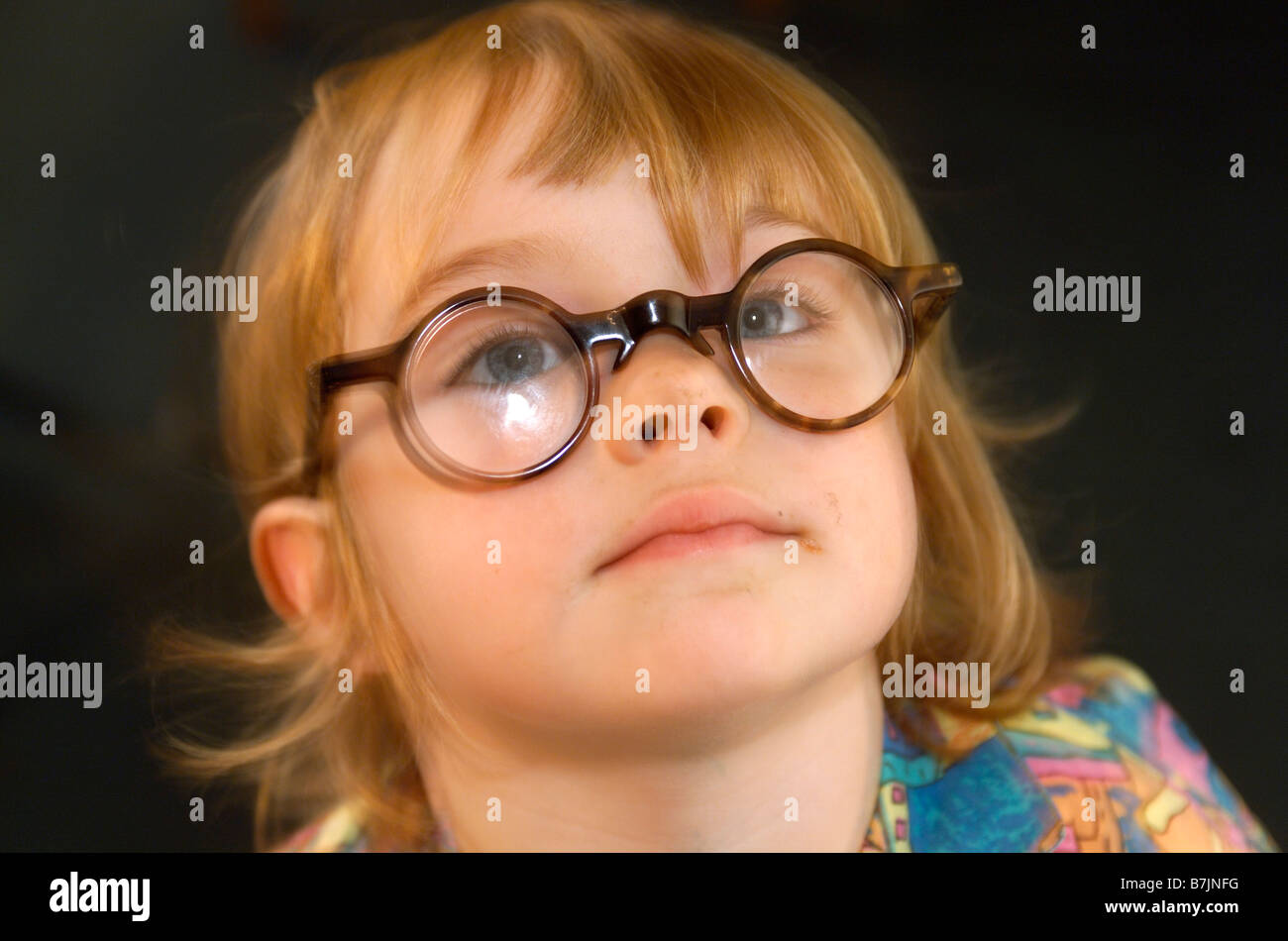 Young girl with round glasses Stock Photo Alamy