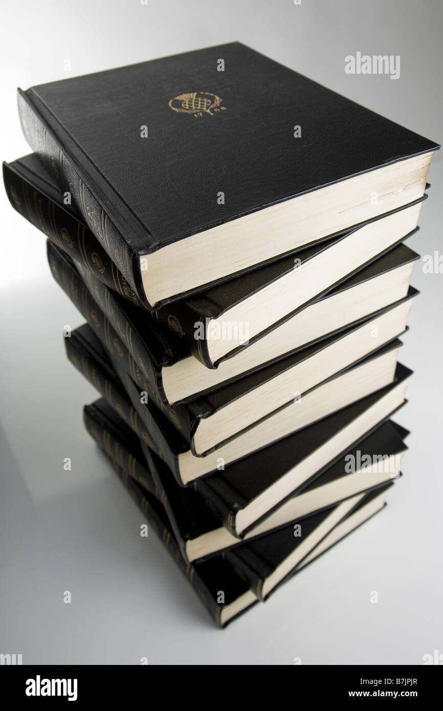 A number of encyclopaedia stacked up on a white background Stock Photo