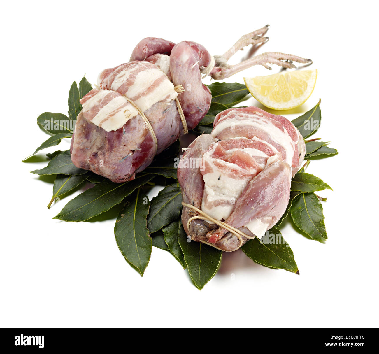 brace partridges prepared ready to bake bacon tied bay leaves Stock Photo