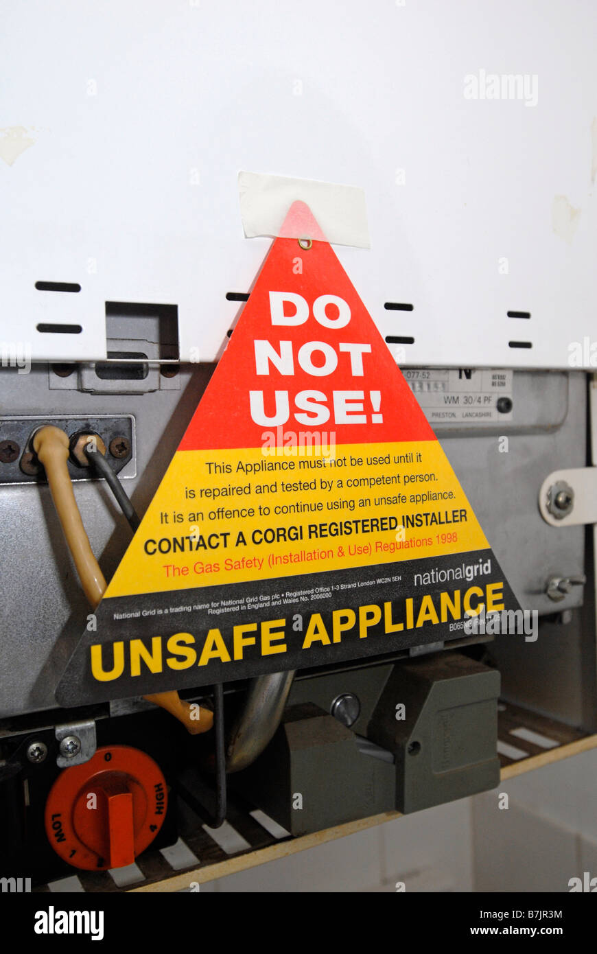 Do not use unsafe appliance sign on a domestic boiler UK Stock Photo