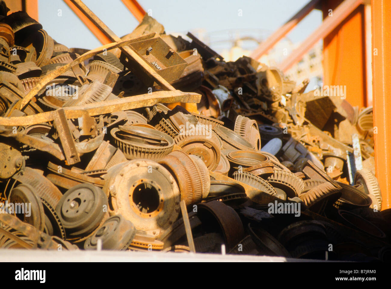 Rusty pile of metal brake drums and other scrap in recycle yard Stock