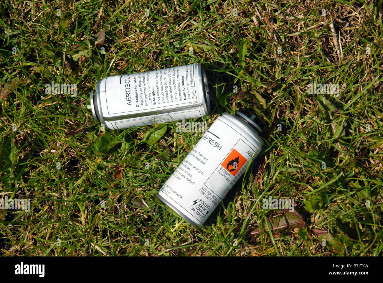Empty aerosol cans in a public park. Suggests solvent abuse by drug addicts a large problem in Europe Stock Photo
