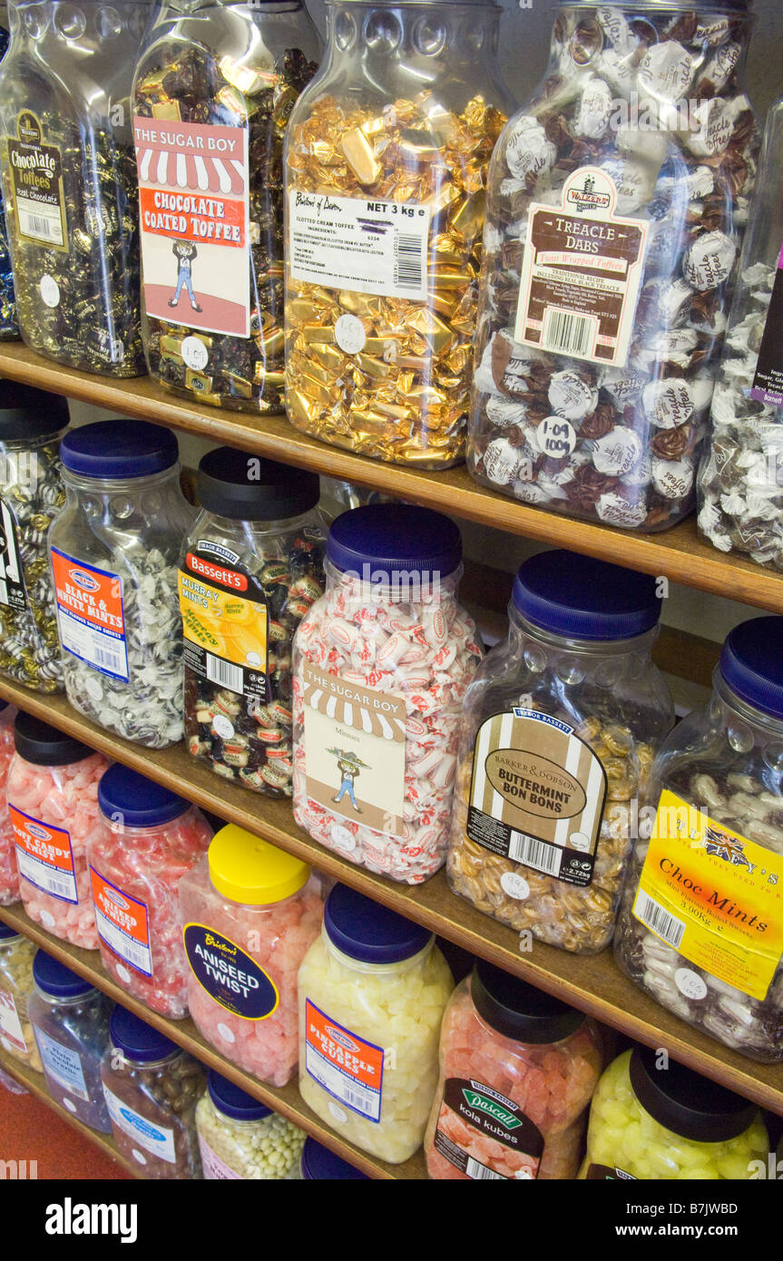 Various jars of sweets for sale in an old fashioned sweet shop displayed in sweet shop jars. Stock Photo