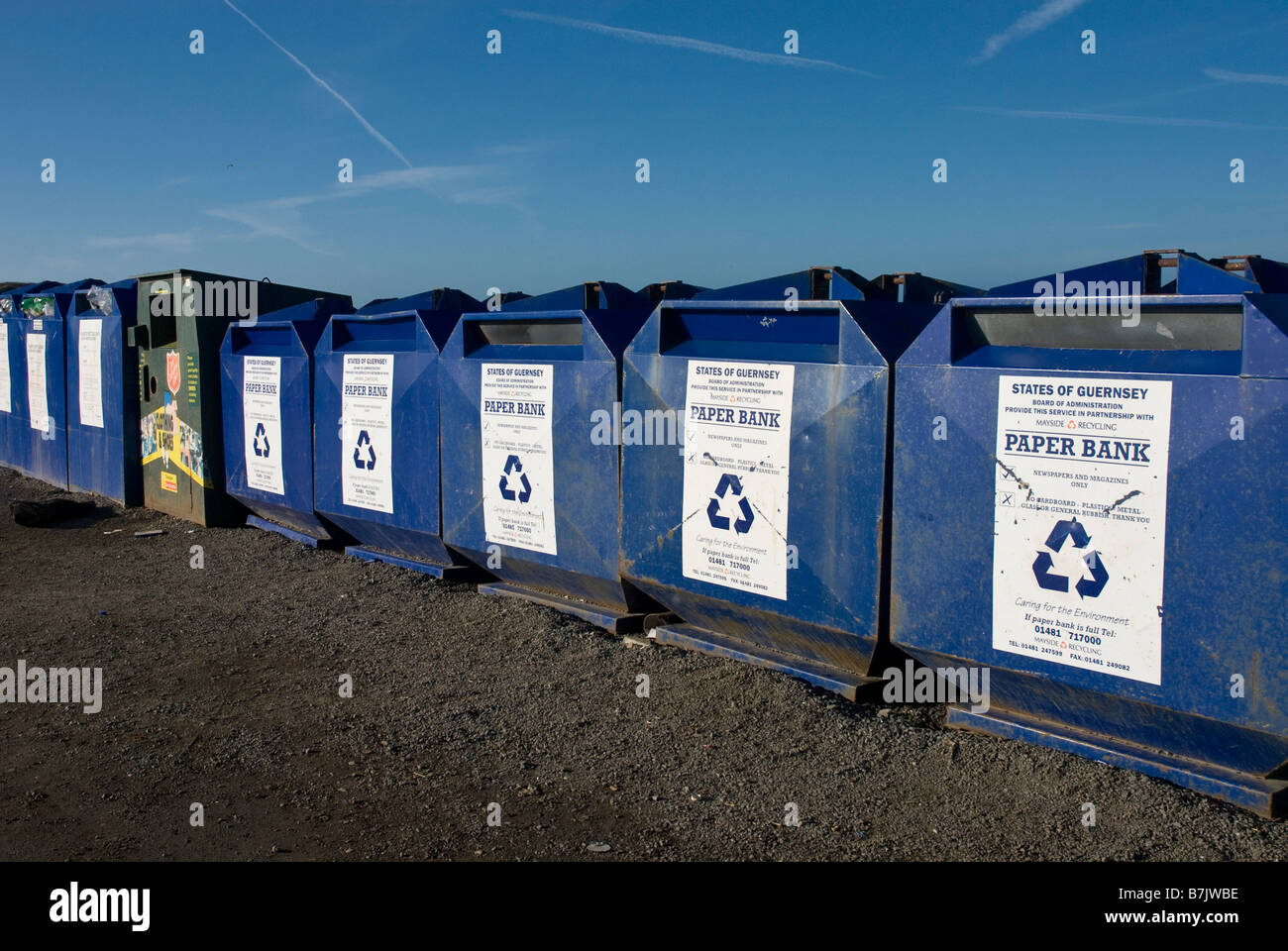 Row of public recycling bins Guernsey Channel Islands United Kingdom Paper and bottel recycling