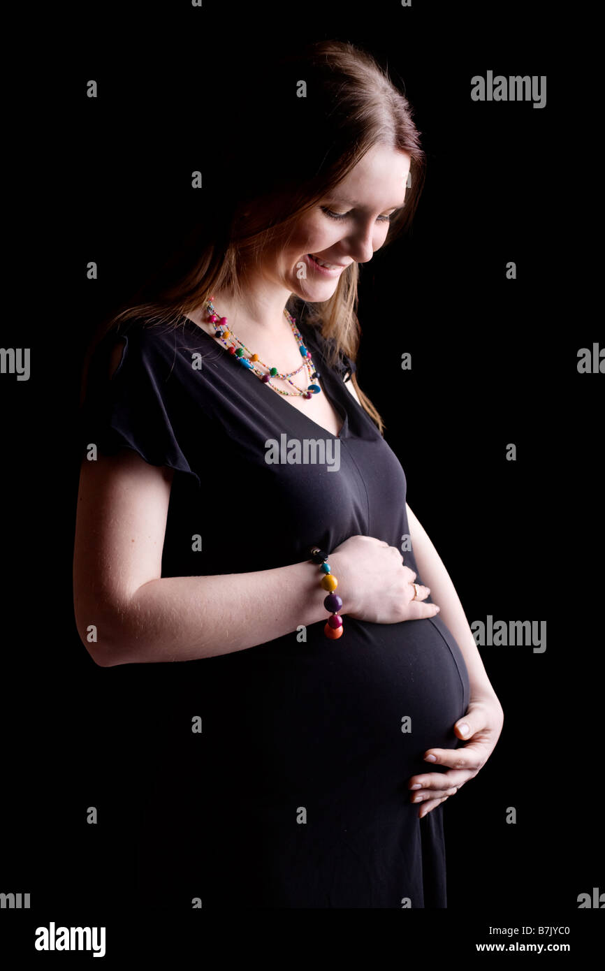 Happy Pregnancy 25 Weeks Pregnant Beautiful Young Woman Talking With Belly Stock Photo Alamy