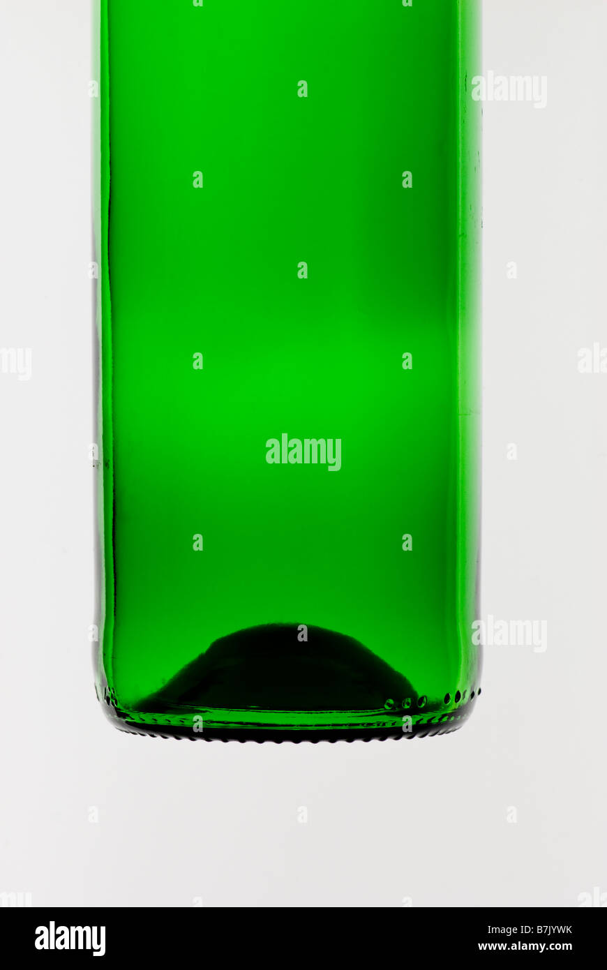 Lower half of empty green glass bottle Stock Photo