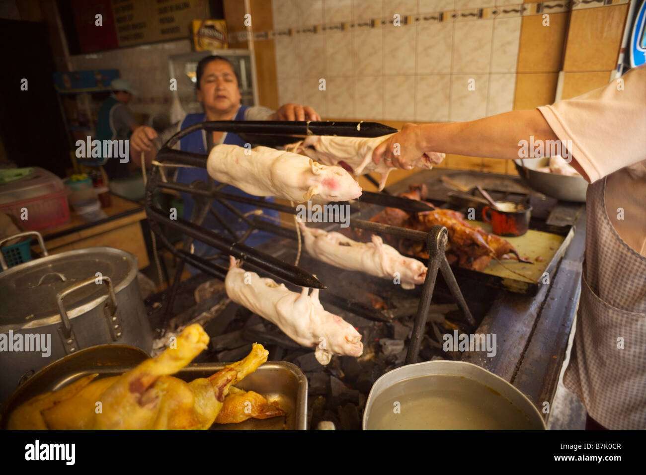 Diner in Ambato, Ecuador, serving roast guinea pig, or 'cuy'. Traditionally a dish reserved for celebrations in Ecuador. Stock Photo