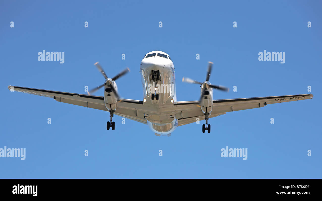 Twin engined propeller aircraft coming in to land Stock Photo Alamy