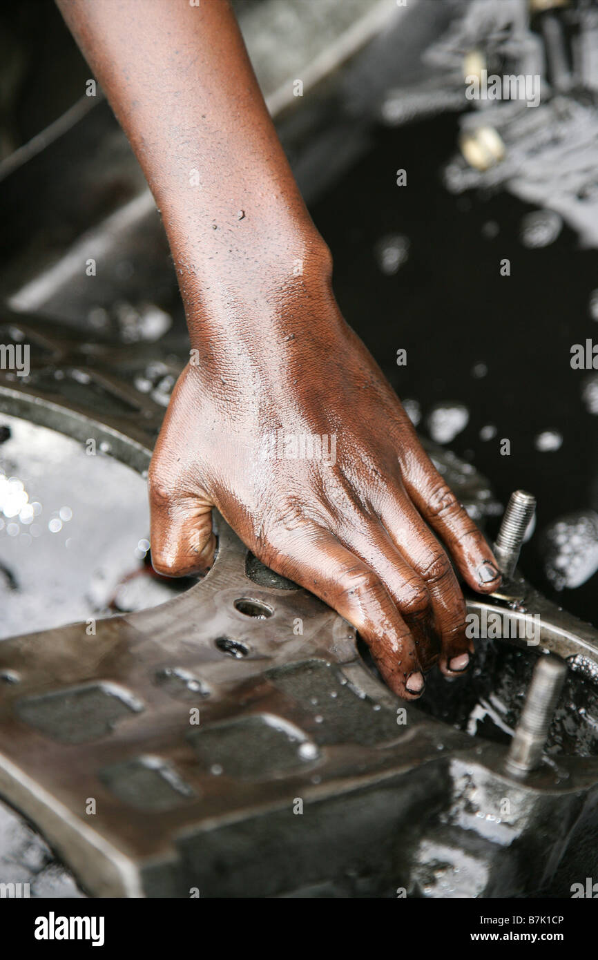 “Boy cleaning an engine”. Stock Photo