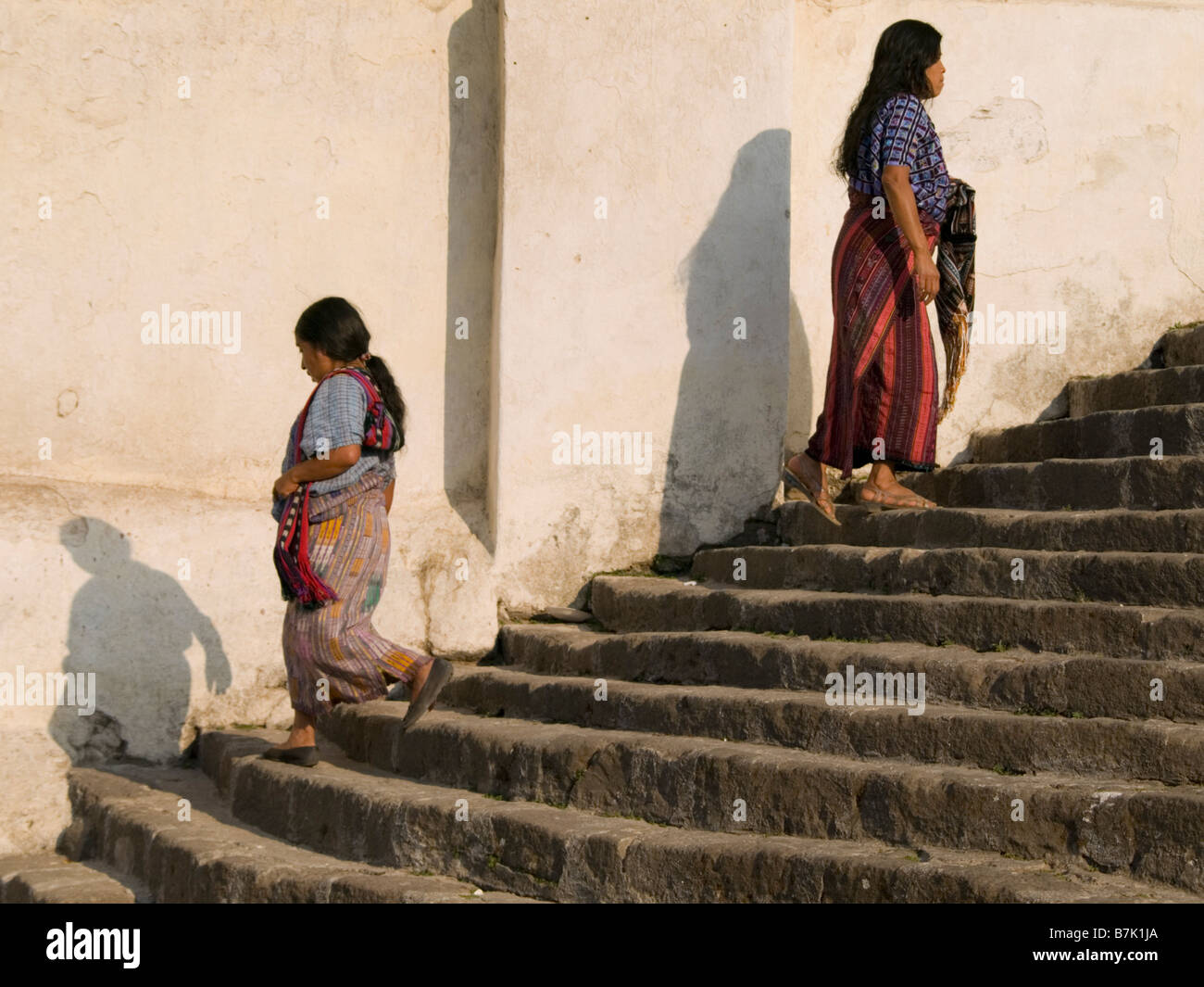 Villagers walking up church stairs Stock Photo Alamy