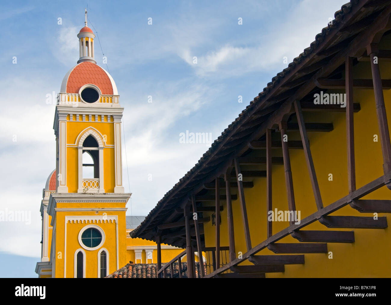 Colonial Granada architecture the Cathedral bell tower and Hotel La Gran Francia facade Stock Photo