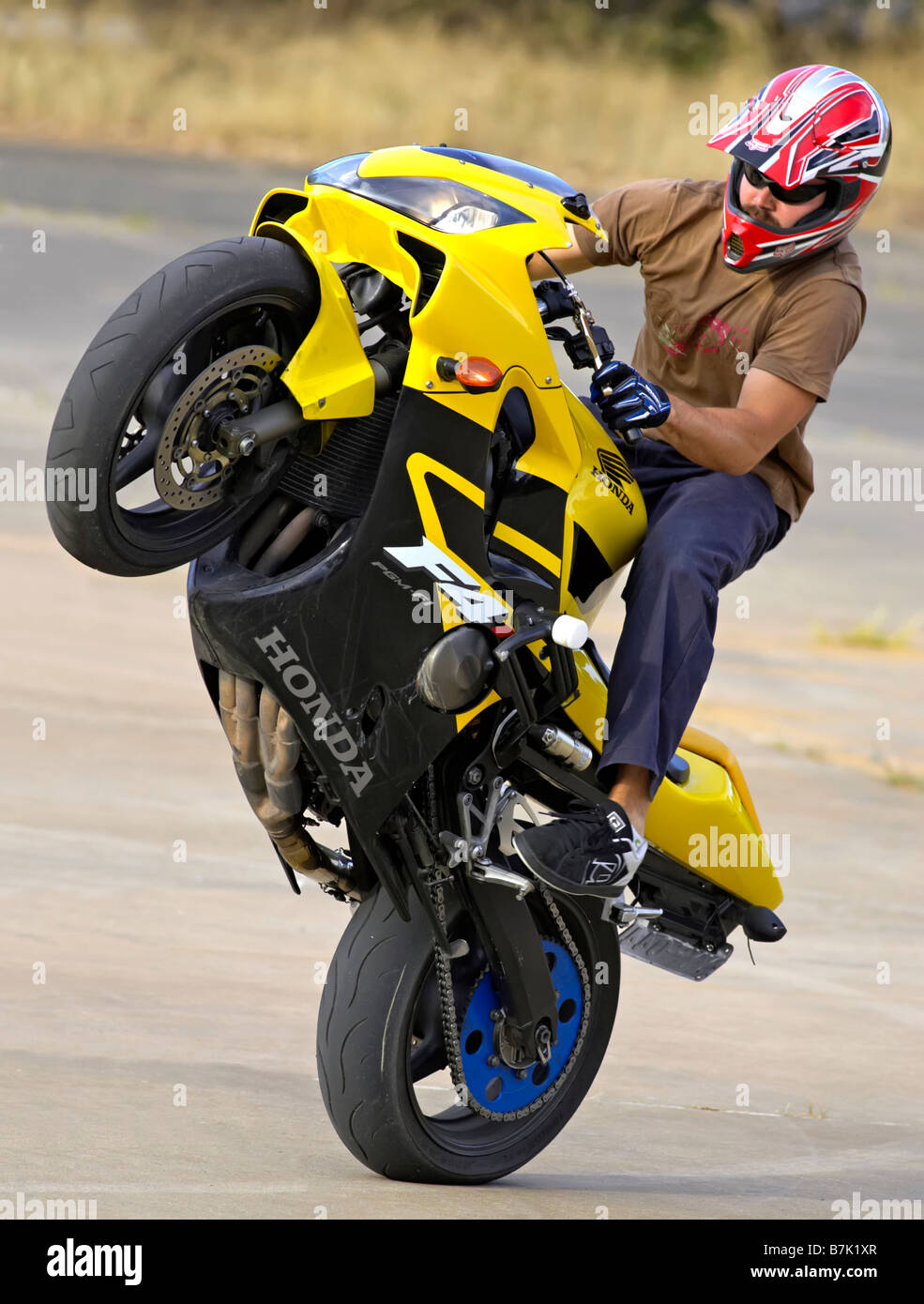 Stunt Rider pulling a wheelie Stock Photo