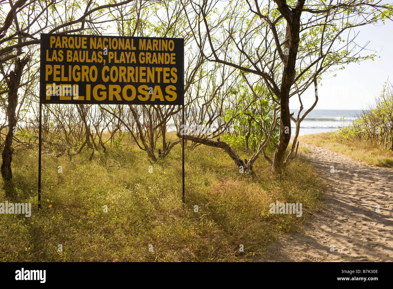 Entrance sign warning of dangerous currents at the Parque Nacional Marino  (Marine National Park) Las Baulas in Playa Grande, Costa Rica Stock Photo -  Alamy