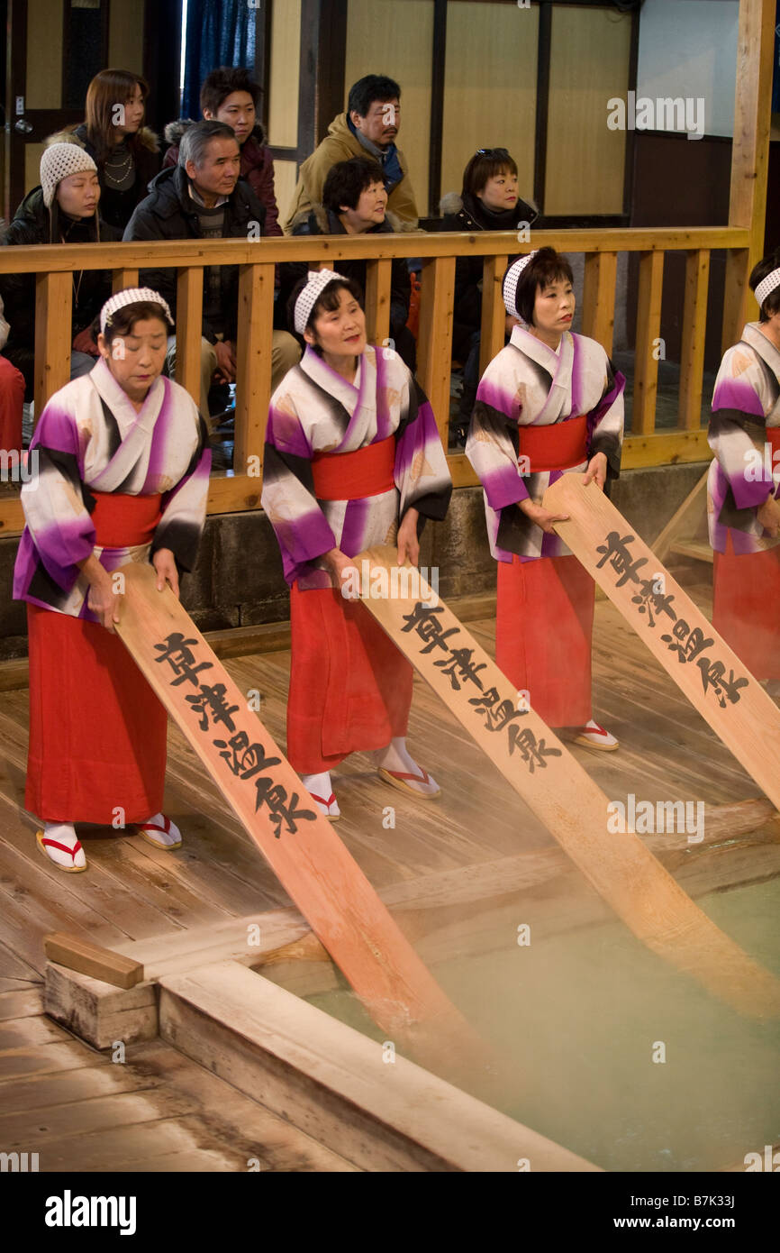 Women performing the Yumomito Odorii water cooling dance to cool down naturally occurring hot spring waters, Kusatsu, Japan. Stock Photo