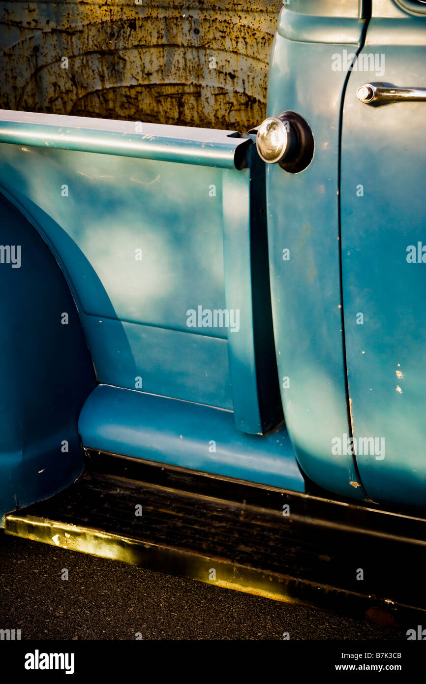 Detail of a vintage pickup truck sitting in the warm evening sunlight. Stock Photo