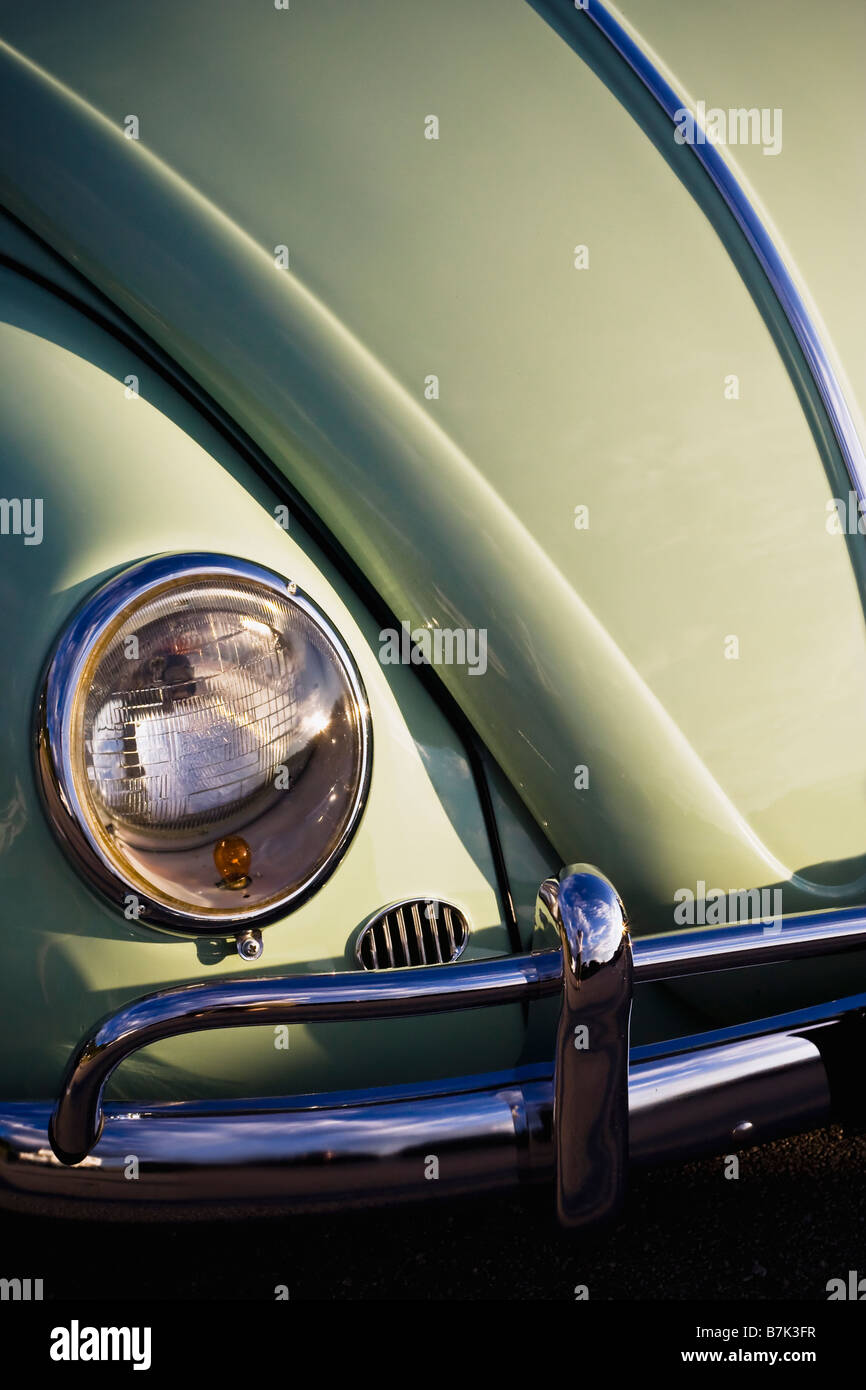 Detail shot of a vintage VW bug painted a pretty pale minty green. Stock Photo