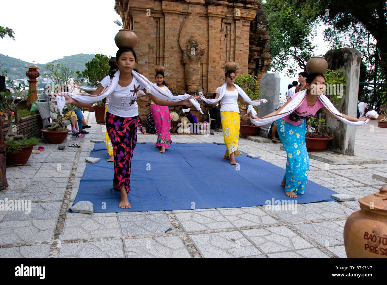 Female Cham dancers performing to traditional Cham dances in an effort ...