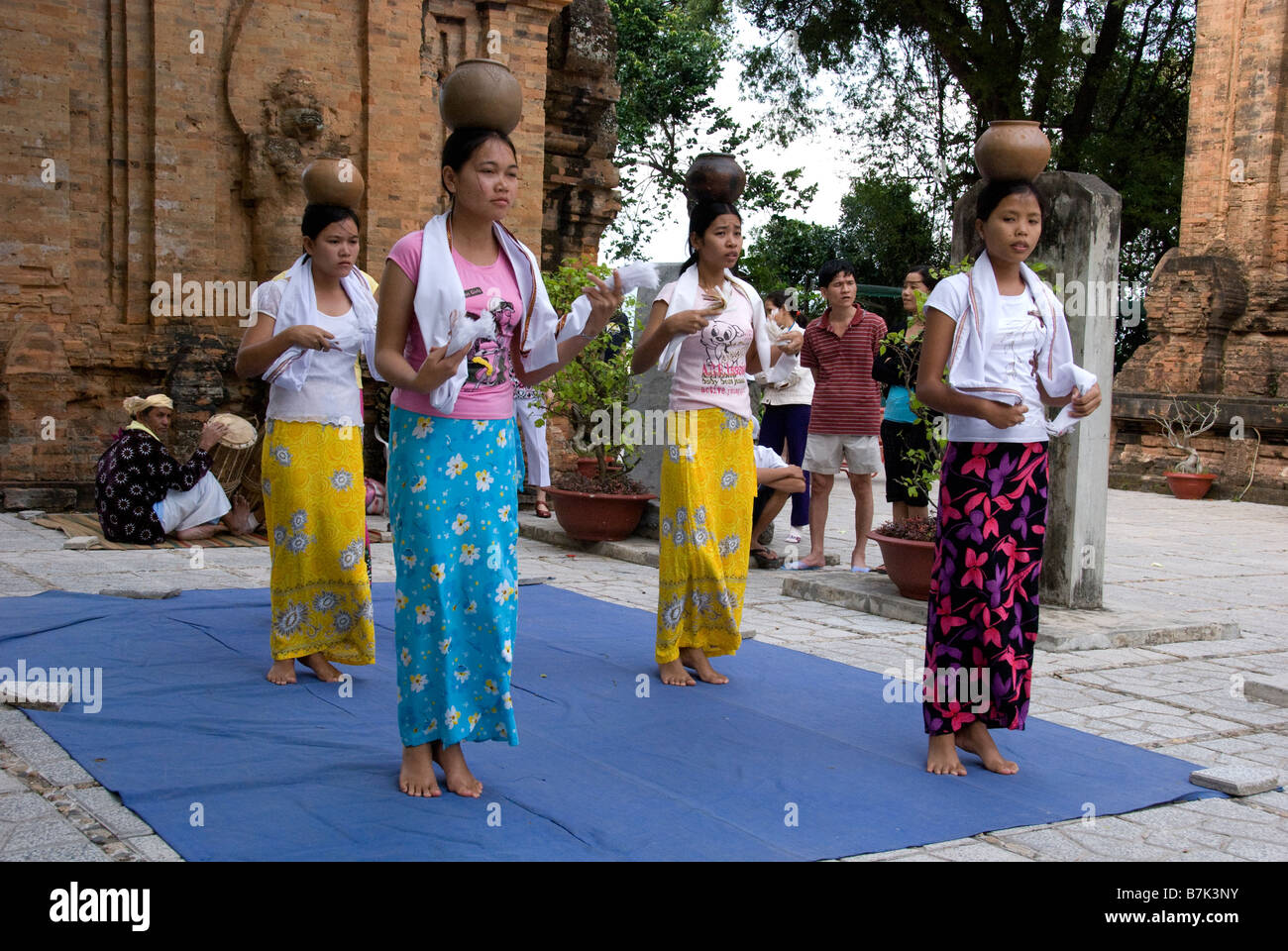 Female Cham dancers performing to traditional Cham dances in an effort ...