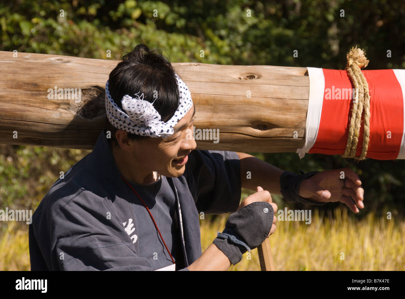 A man holds the end of a nagamochi float at a festival in Shimosuwa ...