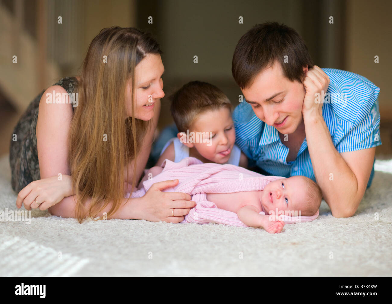 Young family of four hi-res stock photography and images - Alamy