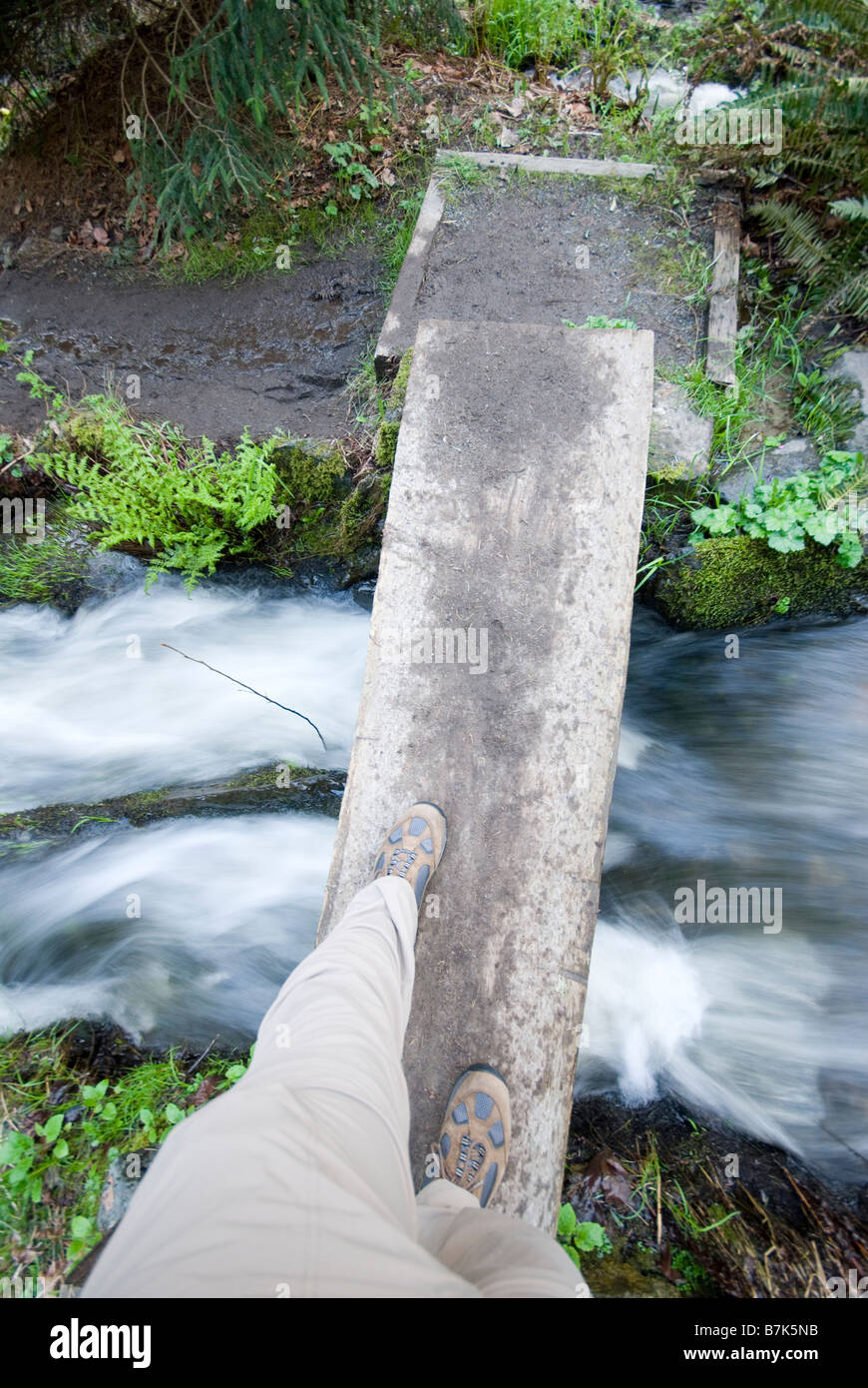 Person walks across narrow bridge hi-res stock photography and images ...