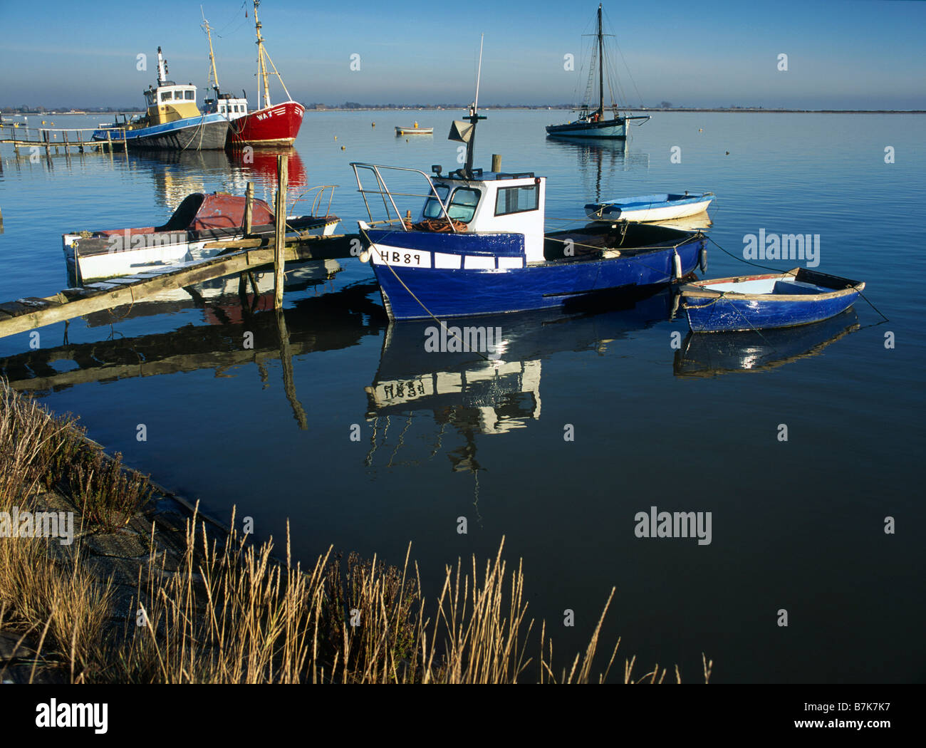 Coast Seawall Mooring fishing boats HEYBRIDGE BASIN ESSEX ENGLAND Stock