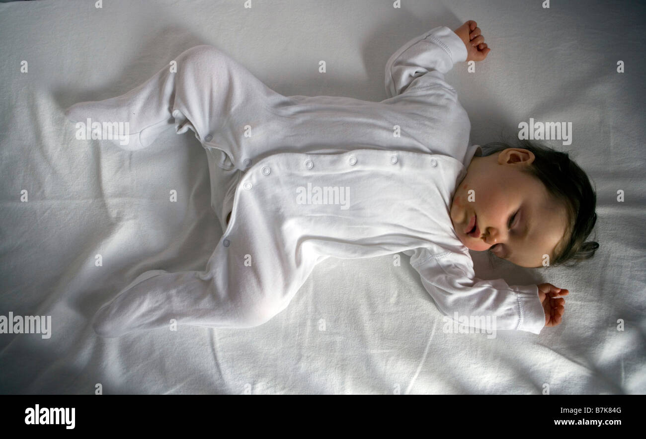A seven month old baby girl sleeping Stock Photo Alamy