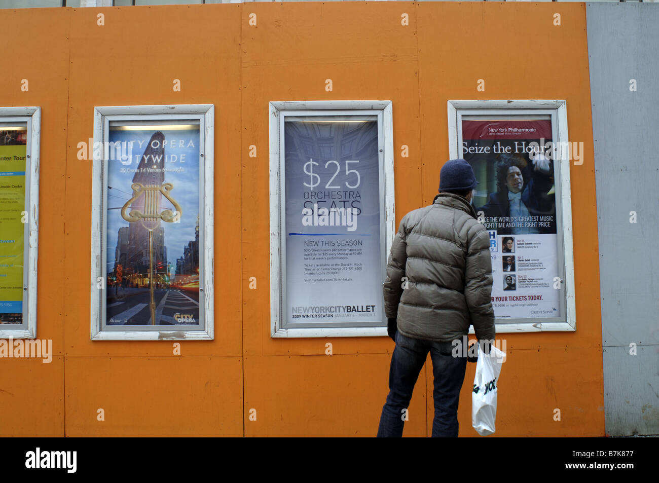 Pedestrians pass an ad for New York City Ballet 25 orchestra seats at Lincoln Center in New York Stock Photo