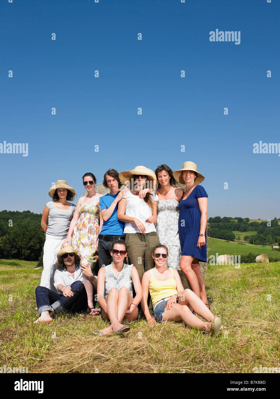 Group of friends in field Stock Photo