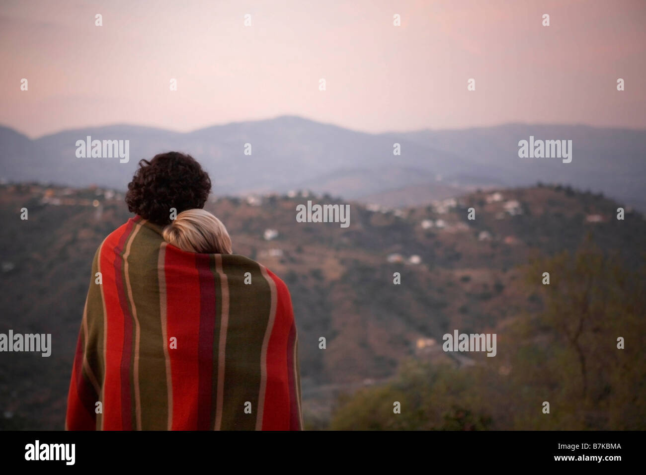 couple sharing a blanket Stock Photo Alamy