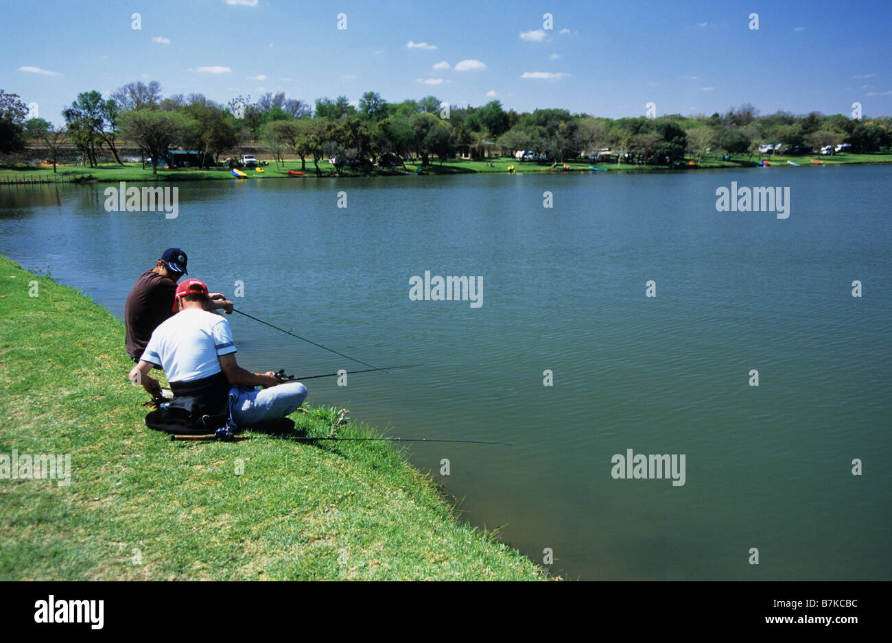 Brits, North West, South Africa, landscape, young adult men fishing at lake, Kleinparadys camping resort, people, background, local tourist Stock Photo